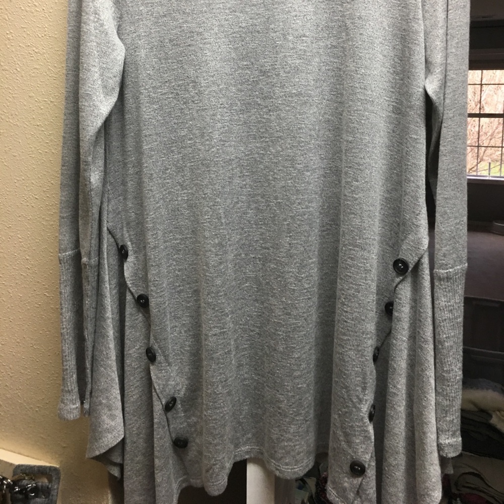 Grey tunic with black button detail on sides